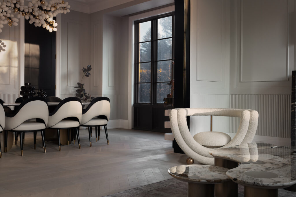 A serene modern living room featuring marble coffee tables, neutral-toned furniture, and artistic decor, professionally photographed by a Toronto interior photographer.